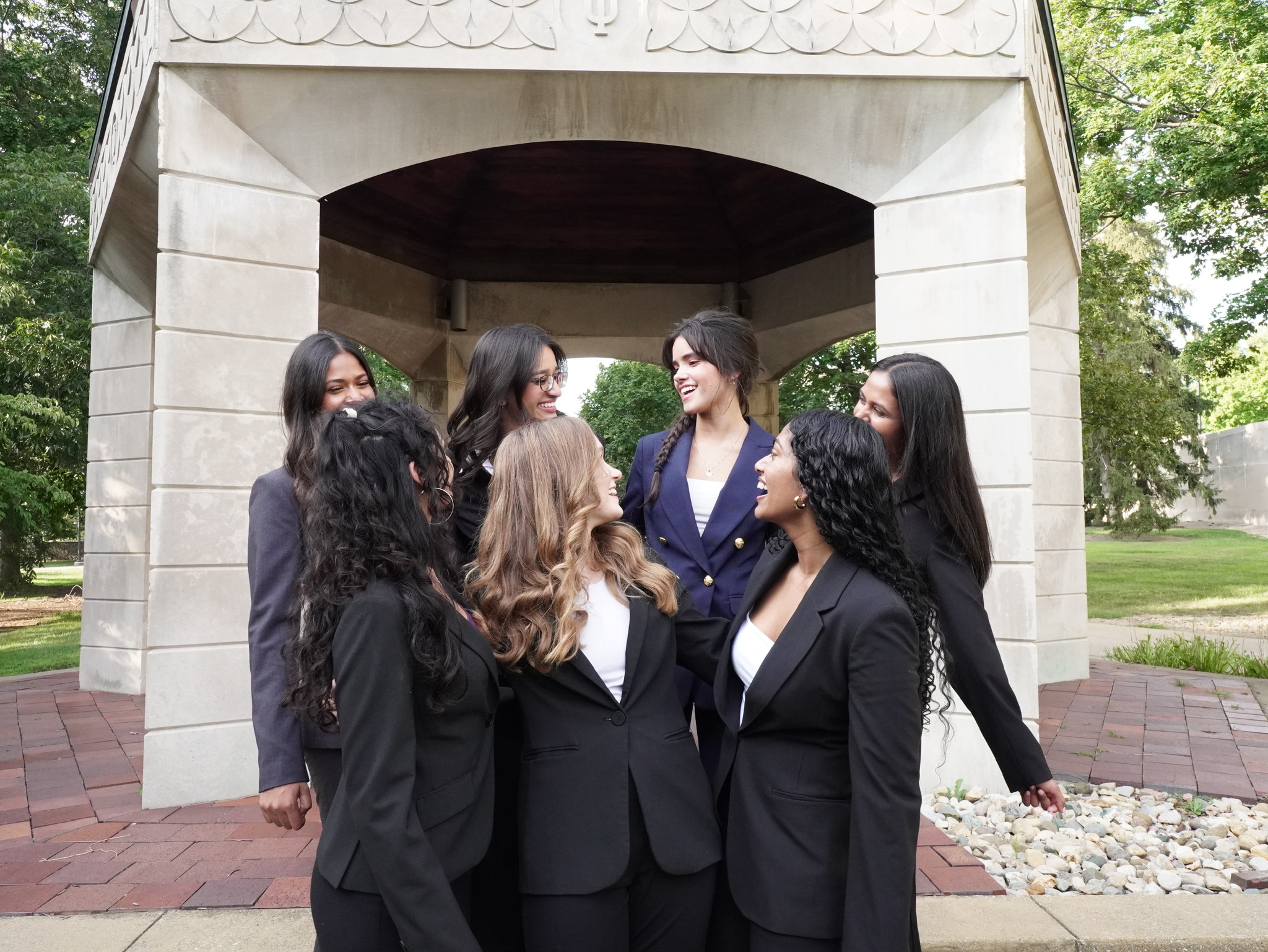 812 Consulting members sharing a candid moment on campus