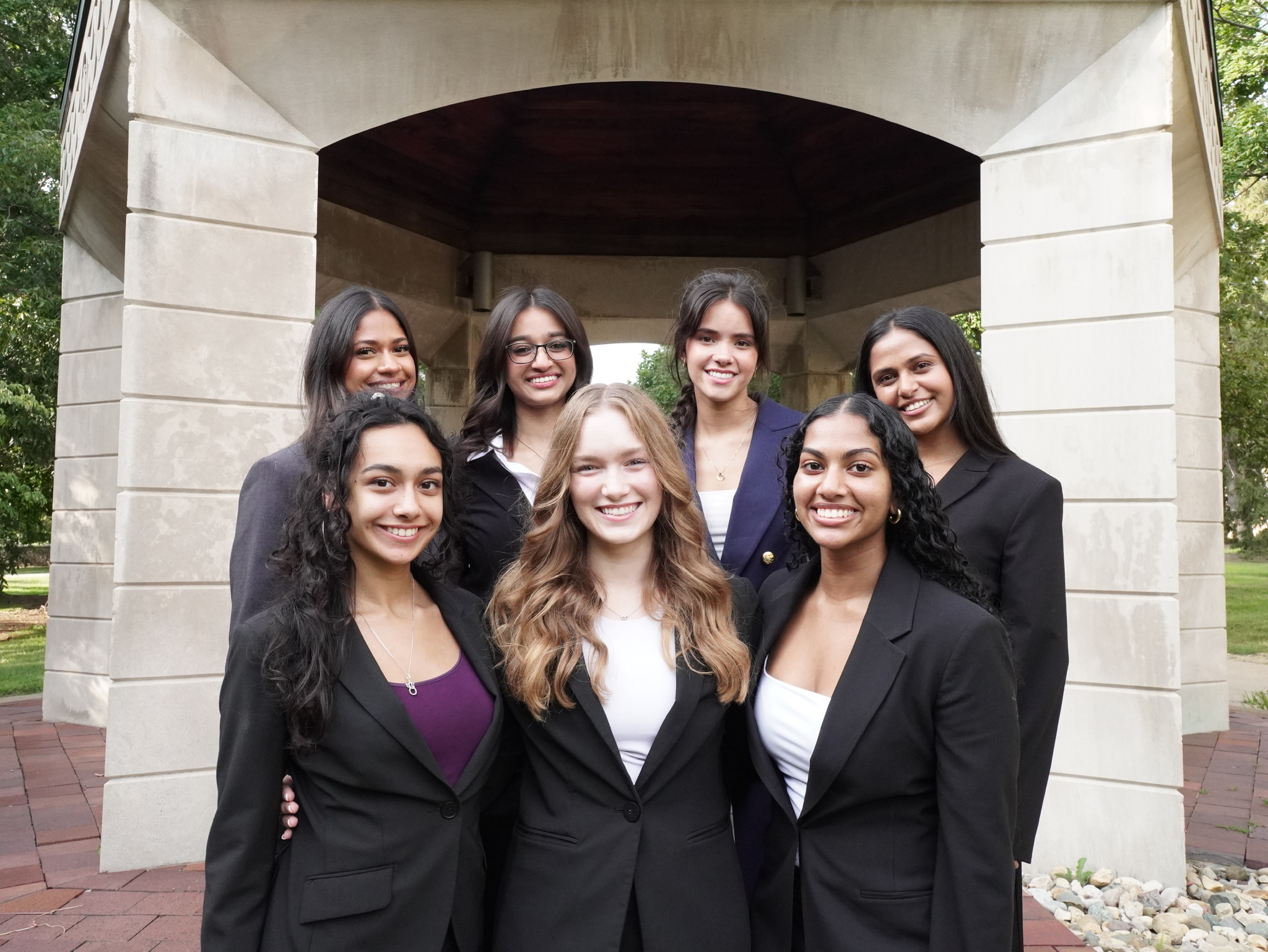 812 Consulting members smiling together on campus